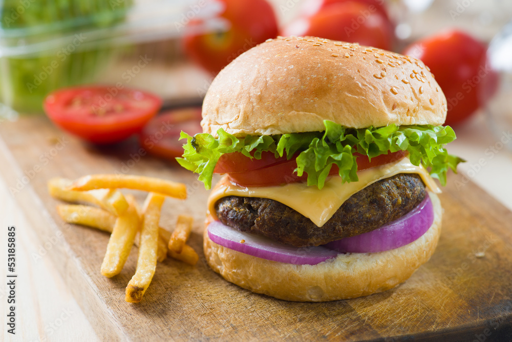 hamburger fast food with plenty of raw materials on the backgrou hamburger fast food with plenty of raw materials on the backgrou