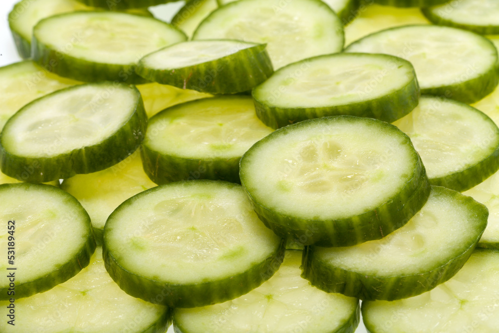 Freshly sliced cucumber isolated on white background Freshly sliced cucumber isolated on white background