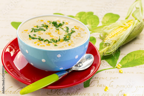 Cream of corn soup in blue bowl