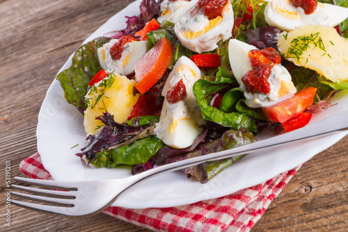 Salad with boiled egg