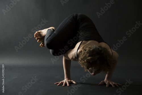 yoga posture parsva bakasana side crow pose front view