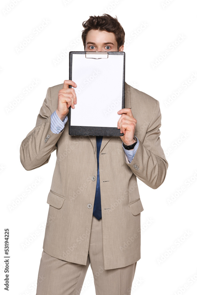 Business man holding blank clipboard in front of his face Business man holding blank clipboard in front of his face