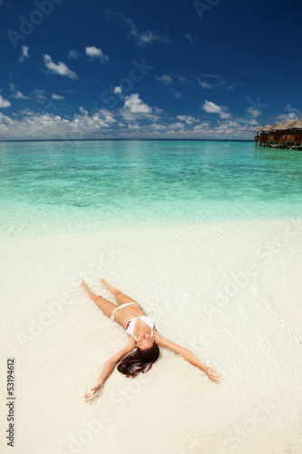 Cute woman relaxing on the tropical beach