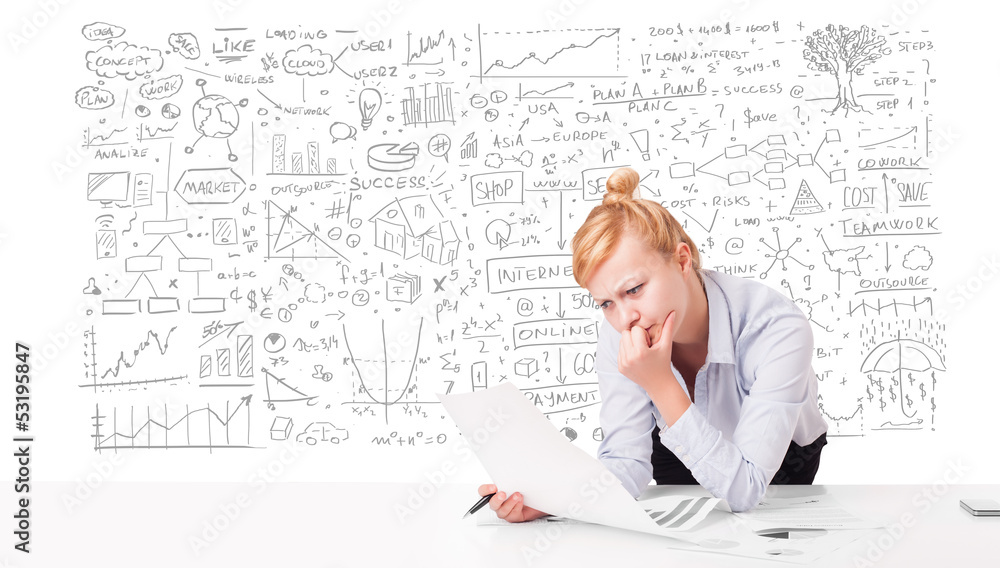 Pretty businesswoman planning and calculating various business i Pretty businesswoman planning and calculating various business i