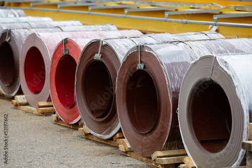 Galvanized coils and Prepainted Galvanized coils lying in stock photo