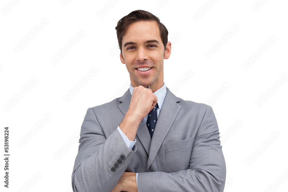 Smiling young businessman looking at the camera Smiling young businessman looking at the camera