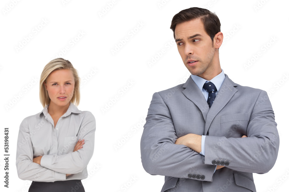 Business people standing together showing rivalry Business people standing together showing rivalry