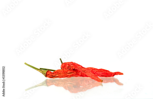 Dried red chili peppers isolated on a white background