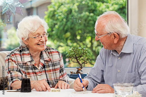 Fototapeta Senior couple playing Yahtzee