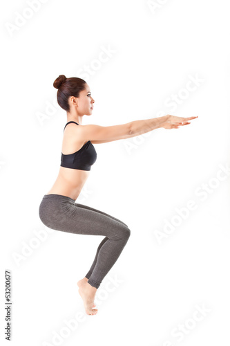 woman making a Yoga pose: Awkward Pose - Utkatasana