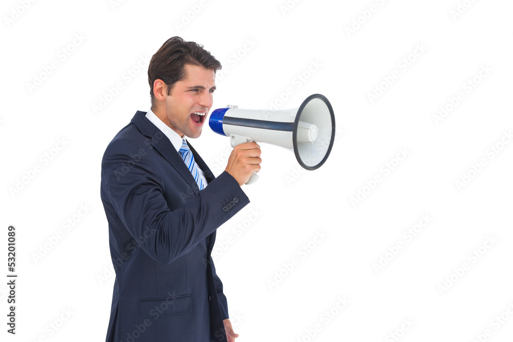 Businessman shouting with a megaphone Businessman shouting with a megaphone