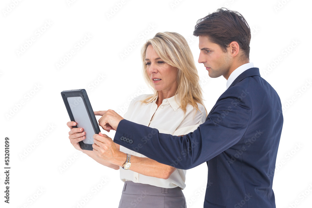 Businessman and woman pointing something on digital tablet Businessman and woman pointing something on digital tablet