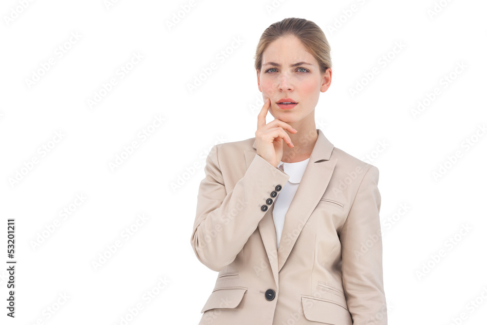 Thinking businesswoman looking at the camera Thinking businesswoman looking at the camera