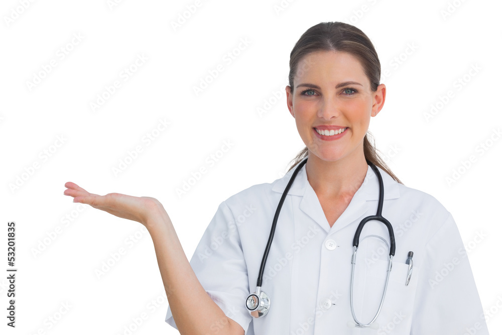 Happy nurse showing something and smiling Happy nurse showing something and smiling