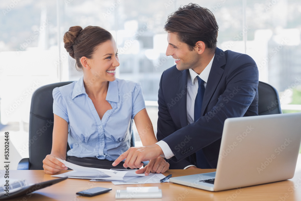 Happy business people working together and smiling Happy business people working together and smiling