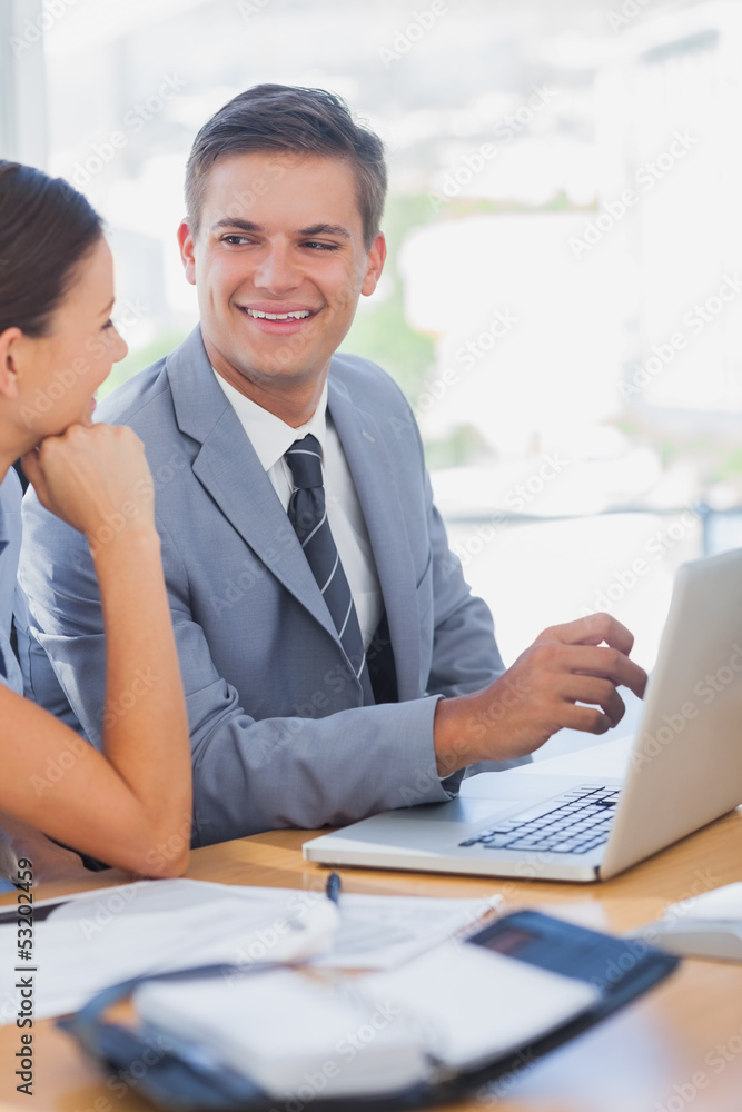 Smiling business people look at each other Smiling business people look at each other