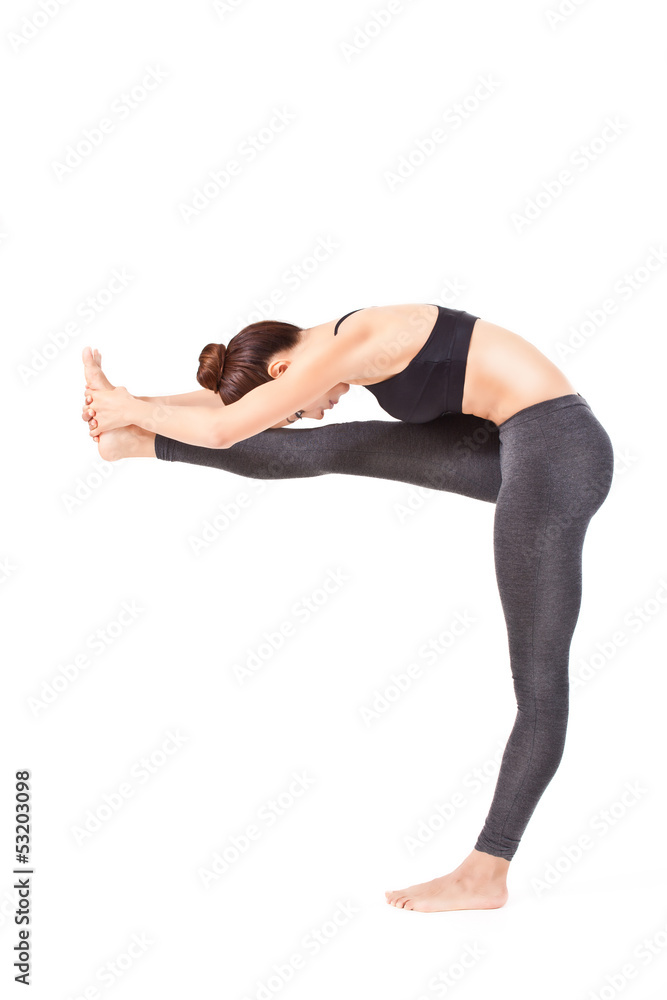 woman making a Yoga pose: Standing Head to Knee Pose