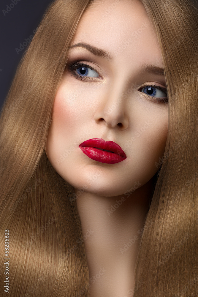 Fashion portrait of a beautiful blonde girl closeup