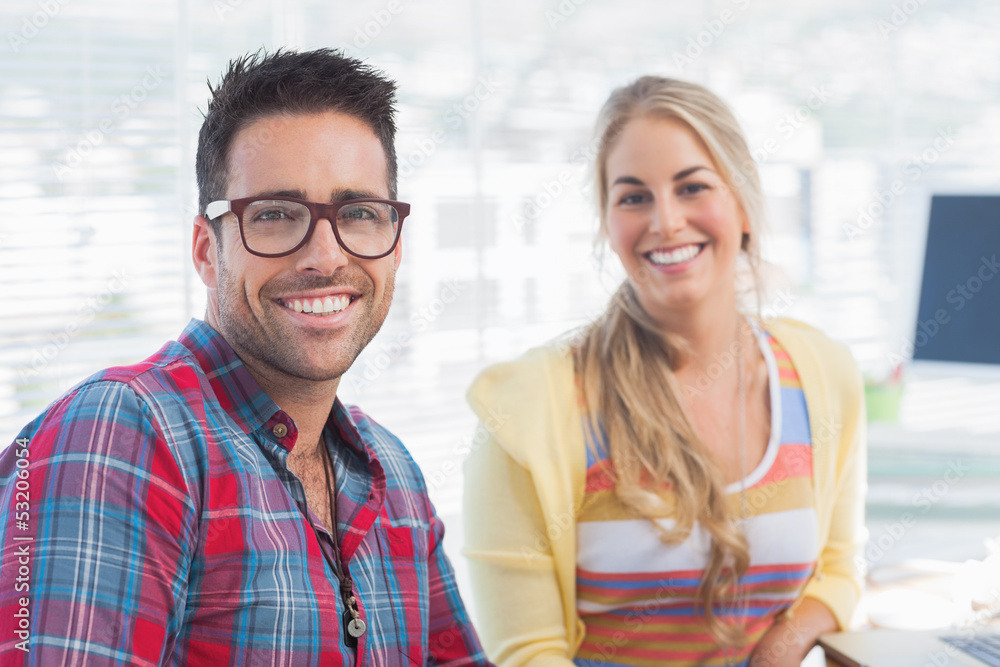 Attractive designers sit in their office Attractive designers sit in their office