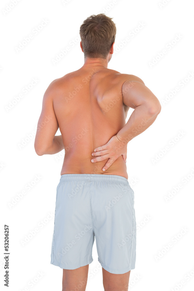 Man with shorts suffering from back pain