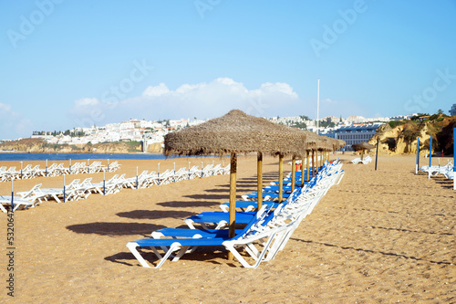 Beach with sunbeds and umbrellas © PhotographyByMK