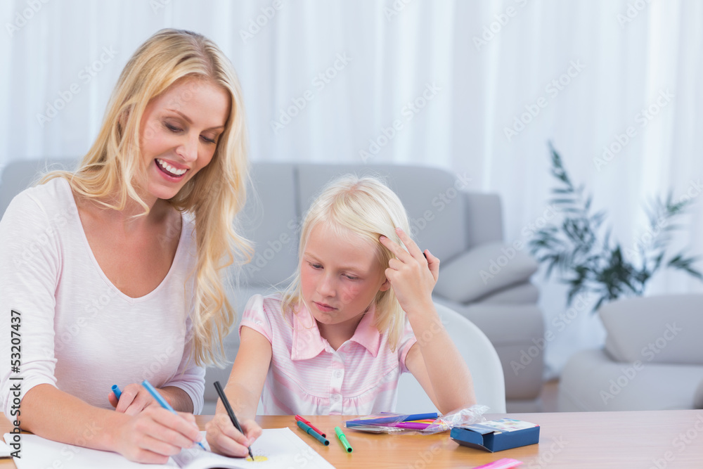 Smiling mother and daughter drawing Smiling mother and daughter drawing