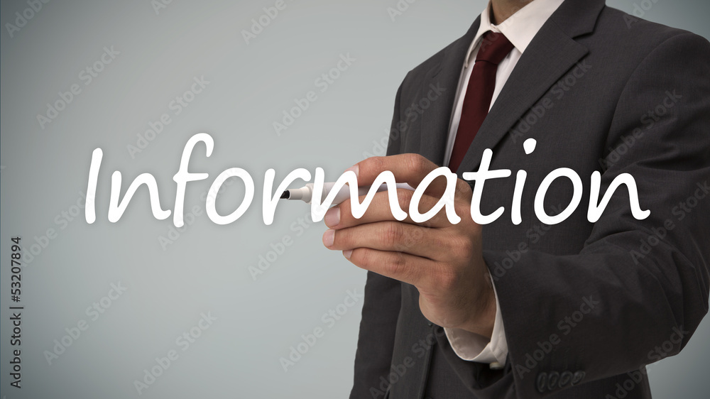 Businessman writing the word information Businessman writing the word information