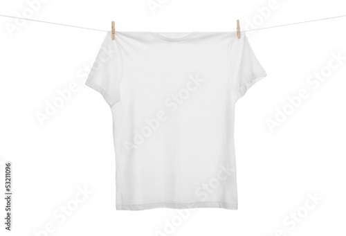 Blank t shirt hanging on the clothes line isolated on white