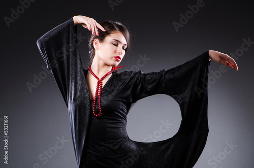 Young attractive woman dancing flamenco