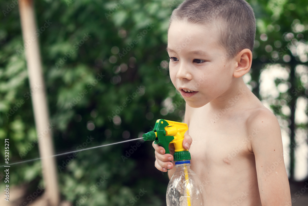 Little boy playing with water splashes. Little boy playing with water splashes.