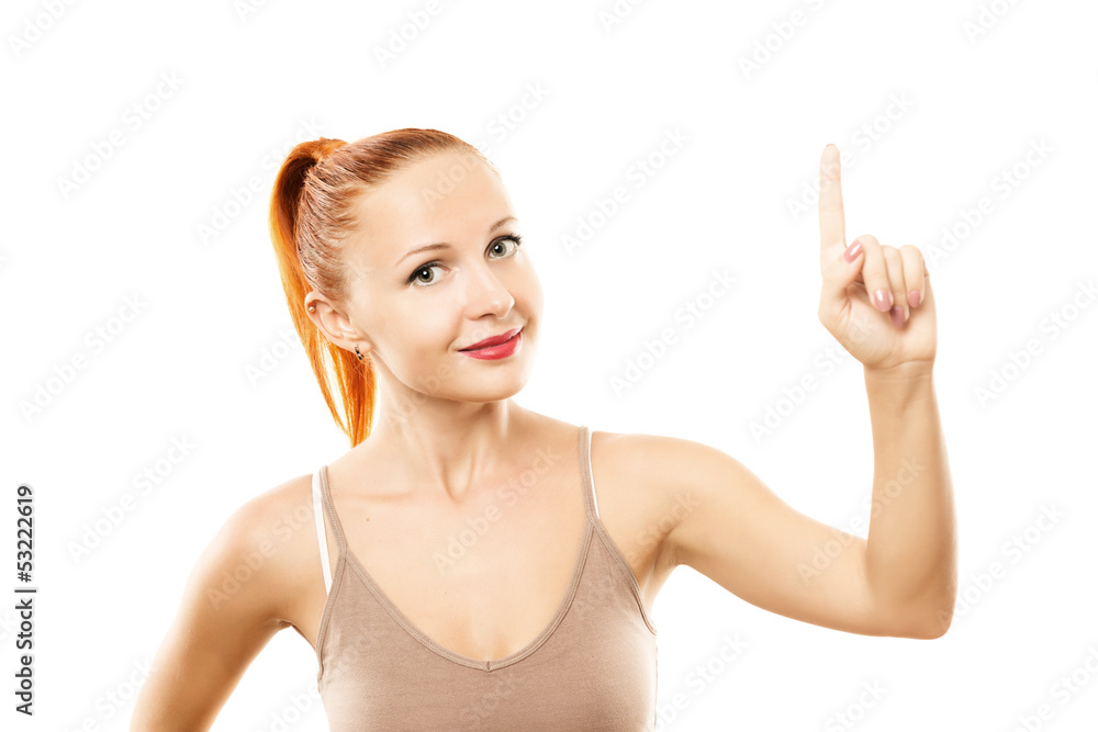 Young woman with healthy skin pointing up Young woman with healthy skin pointing up
