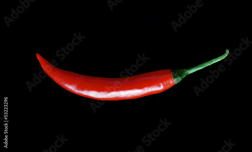 Fresh red hot chili peppers  isolated on black background