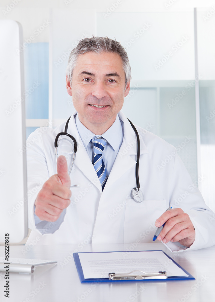 Mature Male Doctor Showing Thumbs Up Sign Mature Male Doctor Showing Thumbs Up Sign