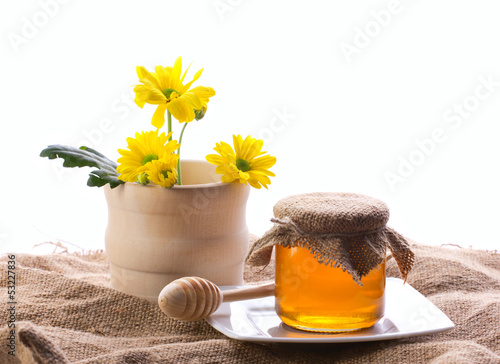 country still with flowers and honey