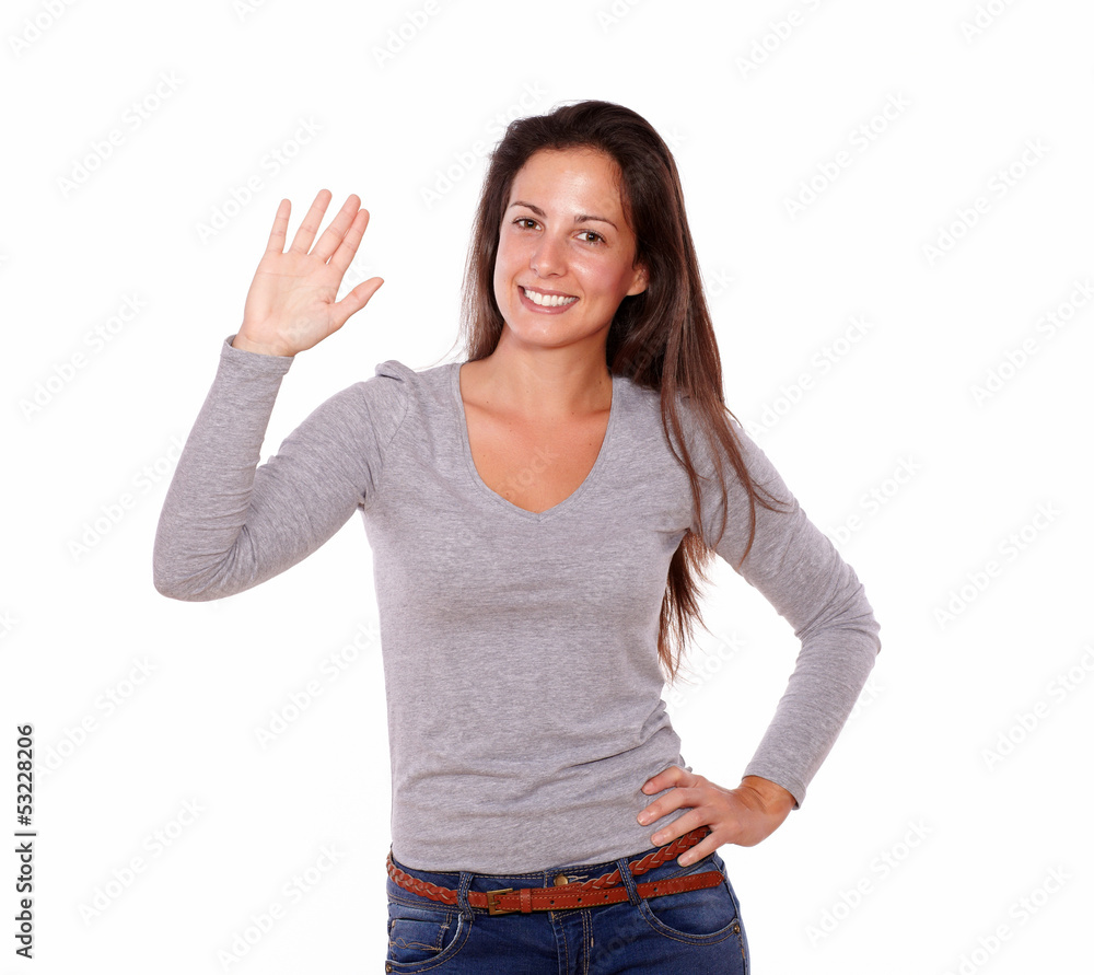 Smiling woman showing greeting gesture with hand Smiling woman showing greeting gesture with hand