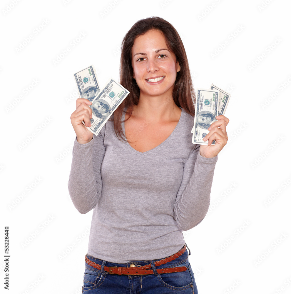 Lovely female holding dollars while standing Lovely female holding dollars while standing
