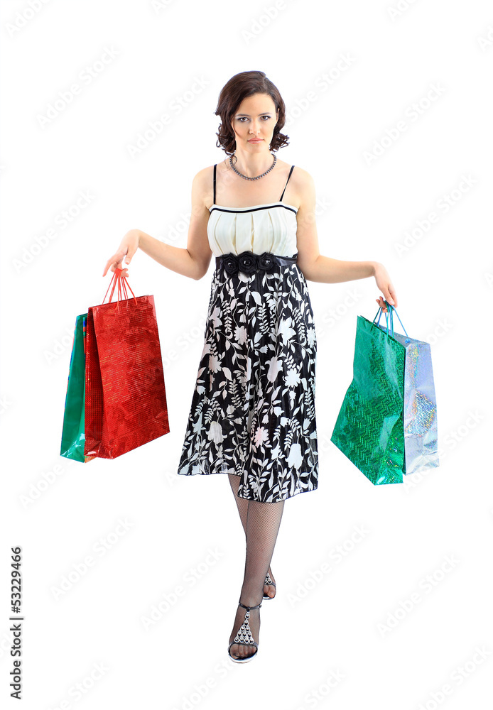 Happy young adult girl, with color-coded bags.