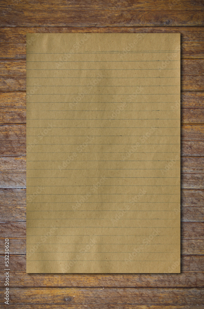 Fototapeta premium old paper on brown wood texture with natural patterns..