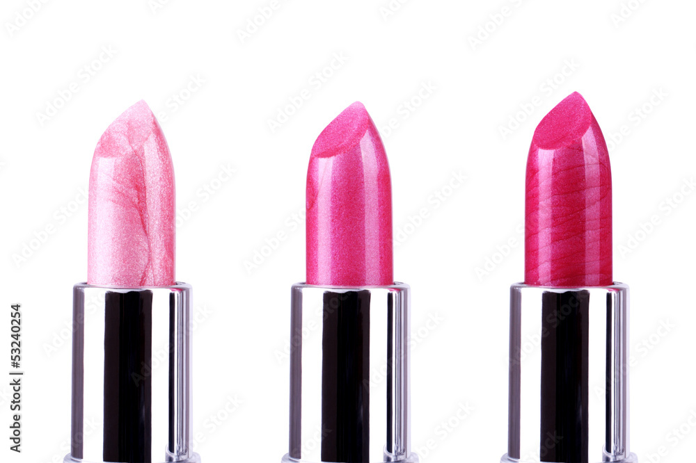 Fototapeta premium Pink lipsticks isolated on white background