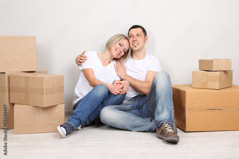 Young couple moving in new house Young couple moving in new house