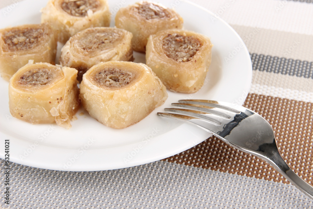 Sweet baklava on plate on table Sweet baklava on plate on table