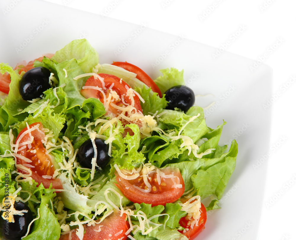 Light salad on plate isolated on white