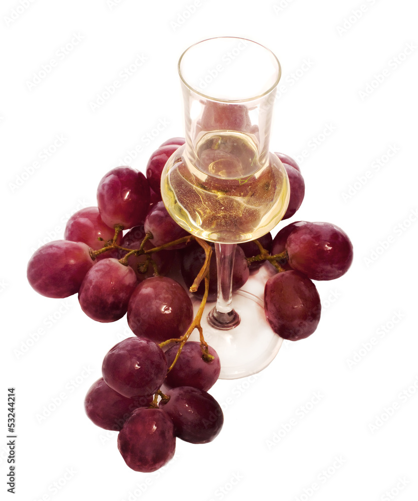 grappa glass with grapes bunch