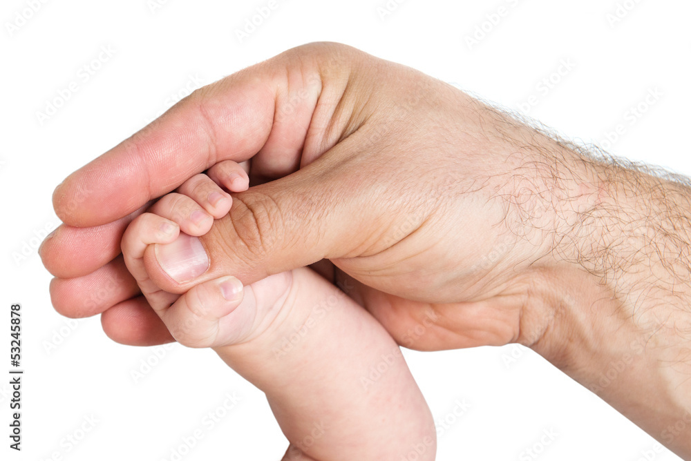 Little baby hand holding father's thumb Little baby hand holding father's thumb