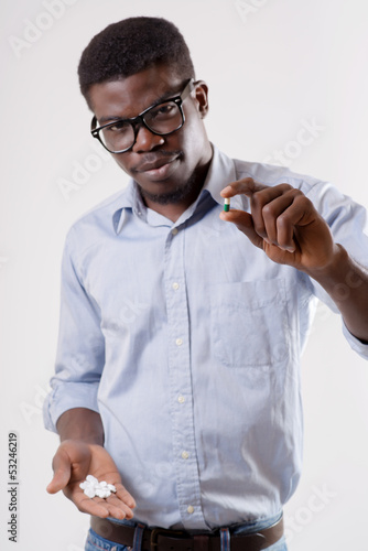 man holding pills