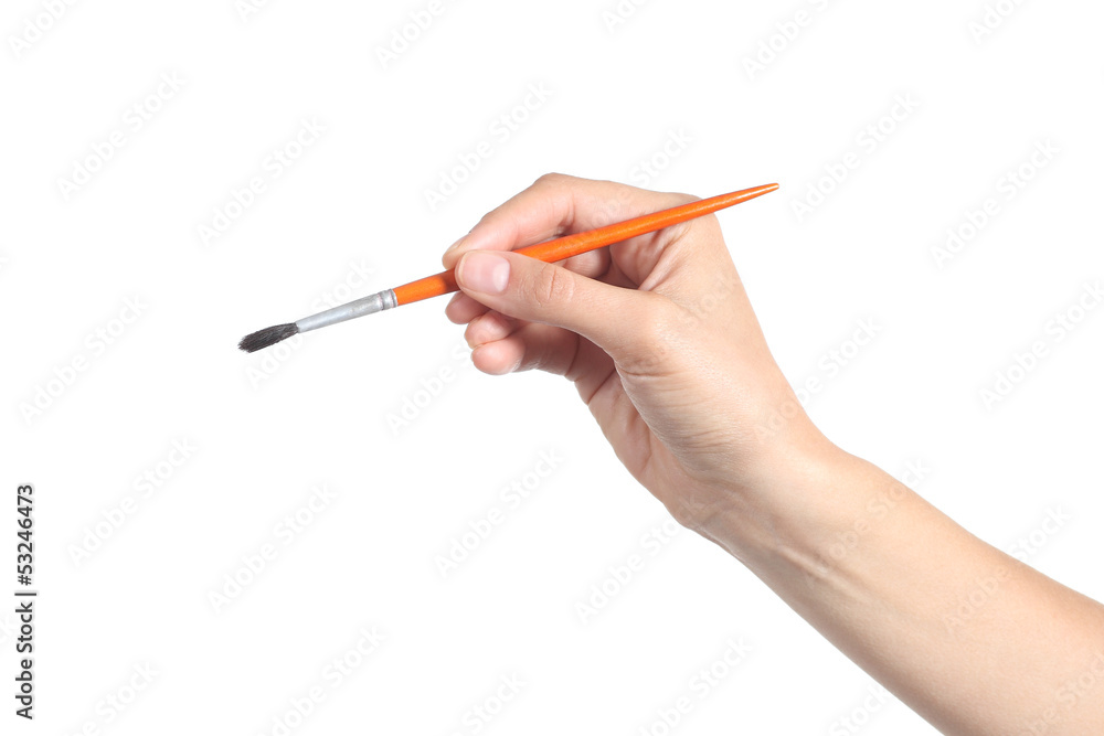 Woman hand using a little paintbrush Woman hand using a little paintbrush