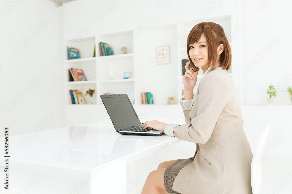 Beautiful young businesswoman working in office Beautiful young businesswoman working in office