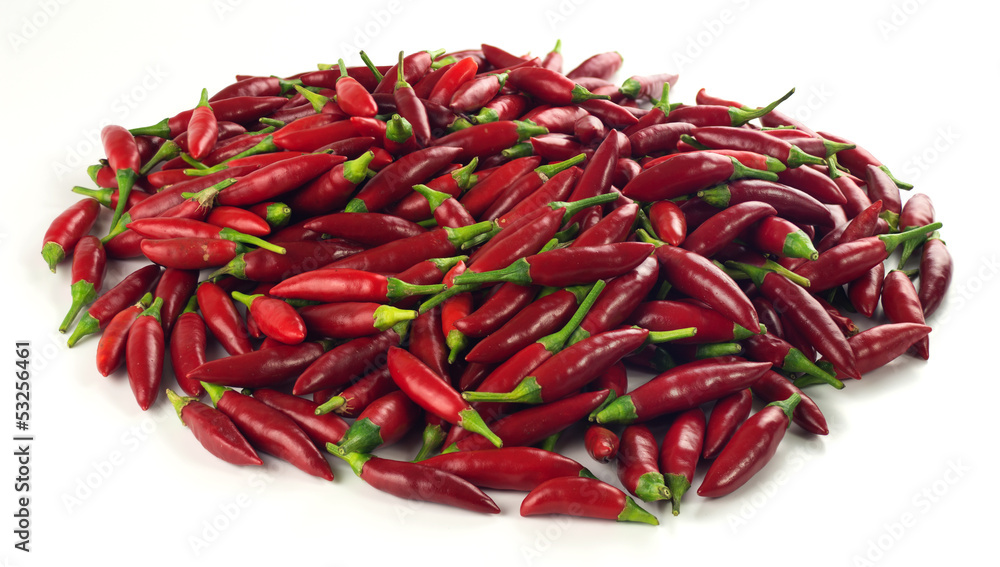 Pile of red chili peppers isolated on white