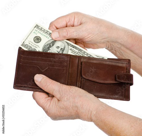 Hand old woman with dollar banknote. isolated on white 