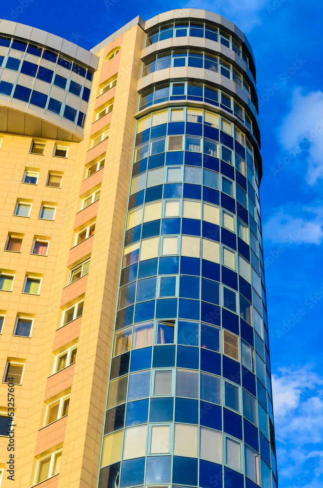 High-rise building on a background of blue sky